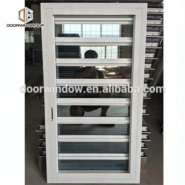 DOORWIN 2021Wood shutter window with roller and mosquito net nets louvers by Doorwin on Alibaba